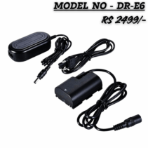 "Image of the DR-E6 AC power adapter kit for Canon cameras. The kit includes three main components: an oblong black AC power converter box with an attached DC output cord, a separate three-pin AC power cord for the wall outlet, and a black DR-E6 dummy battery (DC coupler) with an attached DC input cord. The text overlay reads 'MODEL NO - DR-E6' and 'RS 2499/-'."