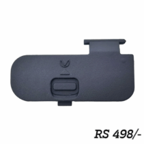 Option 1 (Best for E-commerce & SEO) Black replacement battery door cover for Nikon D3200, D3300, and D3400 DSLR cameras, showing the latch mechanism. Option 2 (Short & Direct) Nikon D3200 D3300 D3400 camera battery door replacement part. Option 3 (Detailed/Accessibility Focused) A black, oblong plastic cover with a central latch mechanism and a small arrow symbol, used as the replacement battery compartment door for Nikon D3200 series DSLRs.