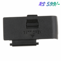 Black plastic replacement battery door cover for a DSLR camera, likely for a Canon 700D/T5i, with the words "BATT.OPEN" and a directional arrow molded into the surface.