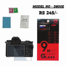 9H HG Tempered Glass Screen Protector for Nikon D800E camera display, shown with packaging, cleaning accessories (wipes, dust absorber), and installed on a camera body.