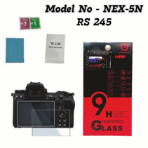 Product packaging for a 9H Tempered Glass Screen Protector for cameras, specifically labeled "Model No - NEX-5N" and priced at "RS 245." The image includes the red and black retail box highlighting features like "9H Strong Hardness," "Explosion proof," and "Bubble Free," alongside the protector glass being demonstrated on a modern mirrorless-style camera body, a blue cleaning cloth, and dust removal stickers.