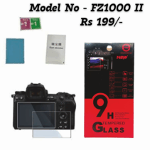 9H Tempered Glass screen protector kit for Panasonic Lumix FZ1000 II camera, showing the retail packaging, cleaning cloth, dust absorber, and the glass protector laid over the camera's rear LCD screen.