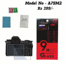 9H Tempered Glass screen protector kit for A7SM2 camera model. The image shows the red and black retail box highlighting features like 9H strong hardness, self-adsorption, bubble-free, and explosion-proof. Also displayed are the glass protector applied to a camera screen, cleaning wipes (wet and dry), a dust absorber sticker, and a microfiber cloth. The price is listed as Rs 399/-.