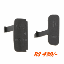 Replacement camera rubber port cover set for Canon EOS 600D, showing two black rubber doors: one labeled 'A/V OUT DIGITAL HDMI' and the other labeled 'MIC'. The price 'RS 499/-' is overlaid in orange text.