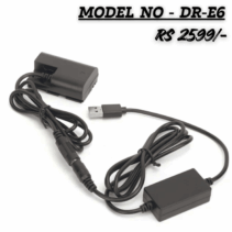 USB-powered DR-E6 Dummy Battery Coupler Kit for Canon DSLRs, showing the USB plug, voltage converter box, coiled cable, and the LP-E6 battery-shaped coupler. Price: Rs 2599/-.