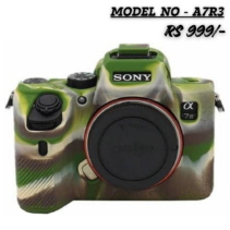 Close-up product image of a black Sony Alpha a7R III (A7R3) mirrorless camera fitted with a protective silicone case featuring a green, brown, and black military camouflage pattern. The camera has a body-mounted lens cap. Overlay text at the top reads "MODEL NO - A7R3" and "RS 999/-".