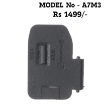 The SEO-Optimized Version (Best for Web Stores) "Replacement battery door cover for Sony Alpha A7 III A7M3 camera showing the internal spring hinge and rubber weather sealing."