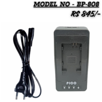 Alt Text: PICO BP-808 battery charger with AC power cord, compatible with Canon BP-808, BP-809, BP-819, and BP-827 camcorder batteries. Includes LED charging status indicators. PICO BP-808 battery charger with AC power cord, compatible with Canon BP-808, BP-809, BP-819, and BP-827 camcorder batteries. Includes LED charging status indicators.