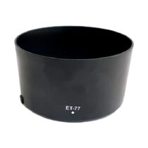 A black cylindrical Canon ET-77 camera lens hood for the RF 85mm f/2 Macro IS STM lens, featuring a matte finish and "ET-77" white lettering with a mounting alignment dot.