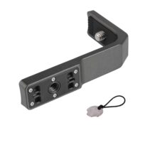 Close-up of a dark grey L-type semi-enclosed frame for Insta360 cameras made of high-strength PPA material for heat resistance and shock protection against a blue sky background.