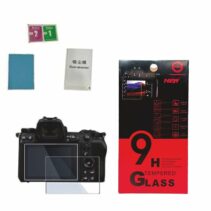 Close-up of PICO ZR 0.33mm ultra-thin tempered glass screen protector held between fingers showing high transparency and slim profile.